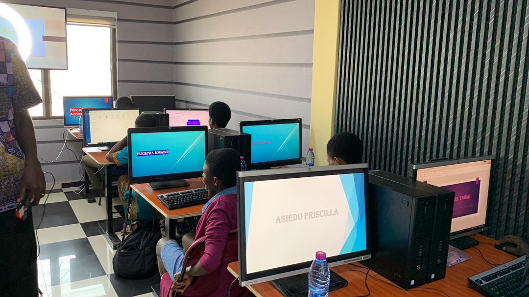 Young people practising computer skills at ThriveWorks Ghana's training suite in Abesim.